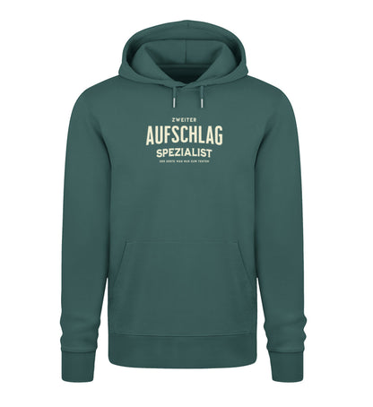  Dunkelgrüner Kapuzenpullover für Tennisspieler mit dem beigen Aufdruck „Zweiter Aufschlag Spezialist – Der erste war nur zum Testen