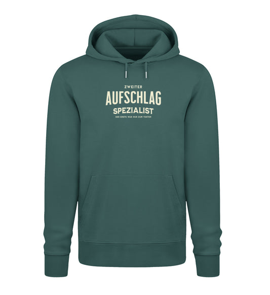  Dunkelgrüner Kapuzenpullover für Tennisspieler mit dem beigen Aufdruck „Zweiter Aufschlag Spezialist – Der erste war nur zum Testen